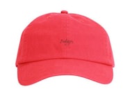 a red baseball cap with the word adios written on it