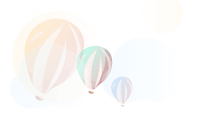 a group of balloons flying in the air